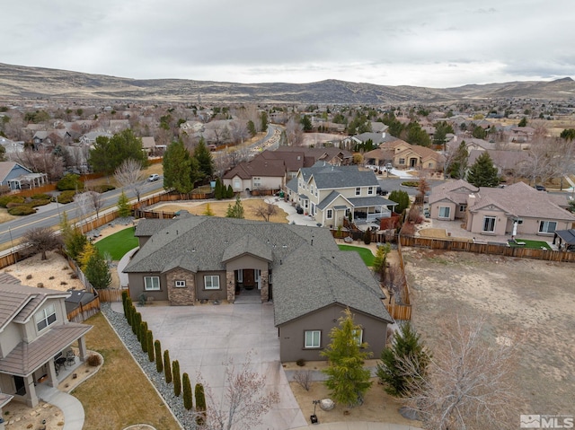drone / aerial view featuring a mountain view and a residential view