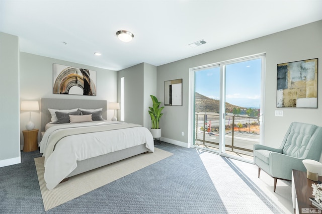 carpeted bedroom with baseboards, visible vents, and access to outside