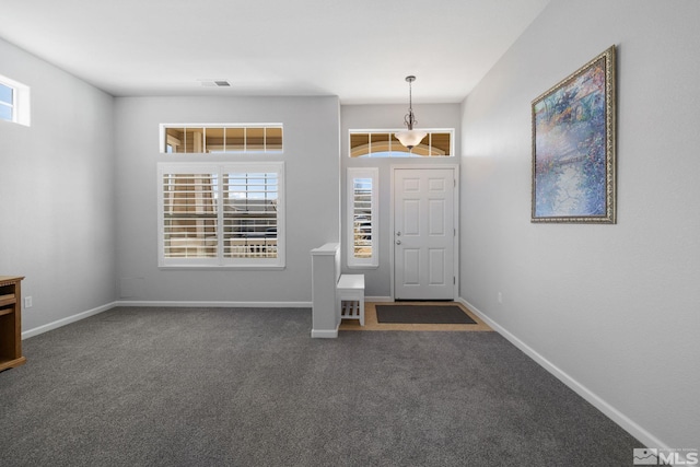 carpeted foyer entrance featuring baseboards and visible vents