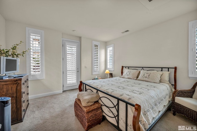bedroom with access to outside, baseboards, visible vents, and light carpet