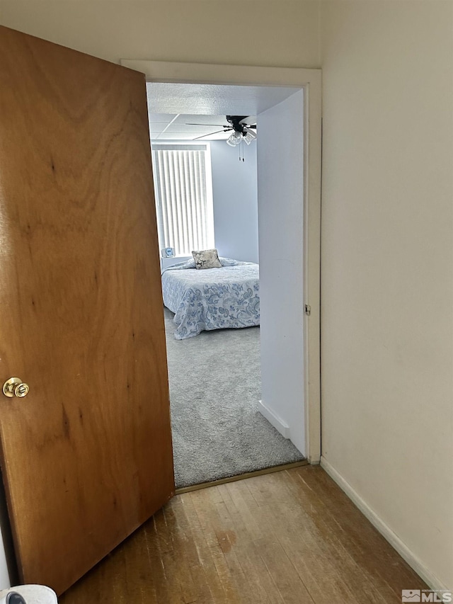 unfurnished bedroom featuring baseboards and hardwood / wood-style floors