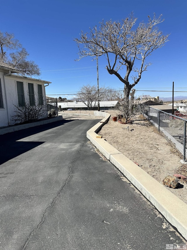 view of street featuring curbs