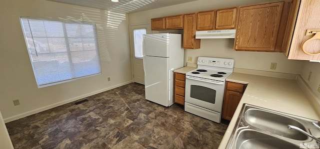 kitchen featuring light countertops, white appliances, baseboards, brown cabinets, and under cabinet range hood