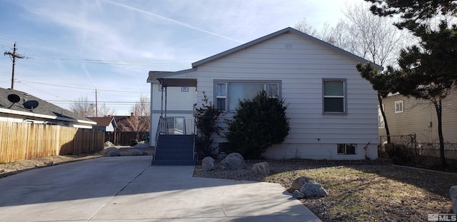 view of front of house with fence