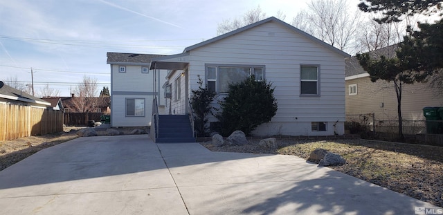 view of front of property featuring fence
