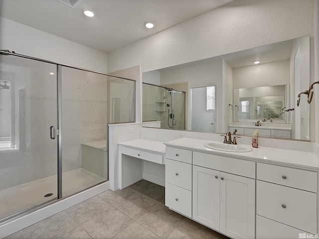 bathroom with tile patterned flooring, vanity, recessed lighting, and a shower stall