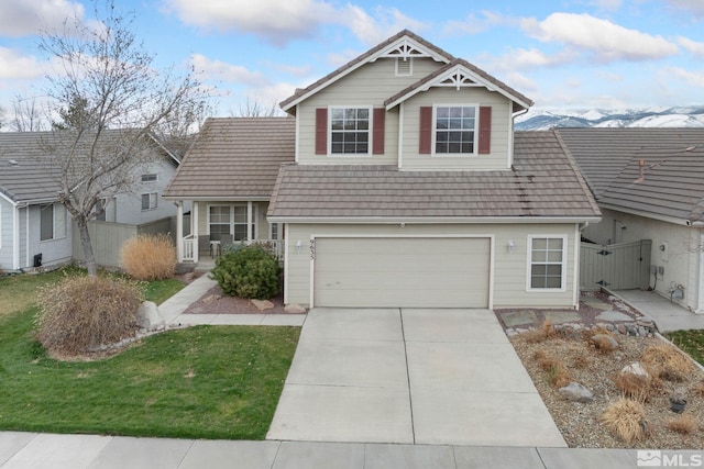 view of front of property with a gate, fence, a garage, a front lawn, and driveway
