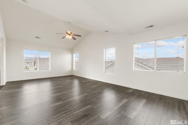 unfurnished room with vaulted ceiling, dark wood-style floors, ceiling fan, and visible vents