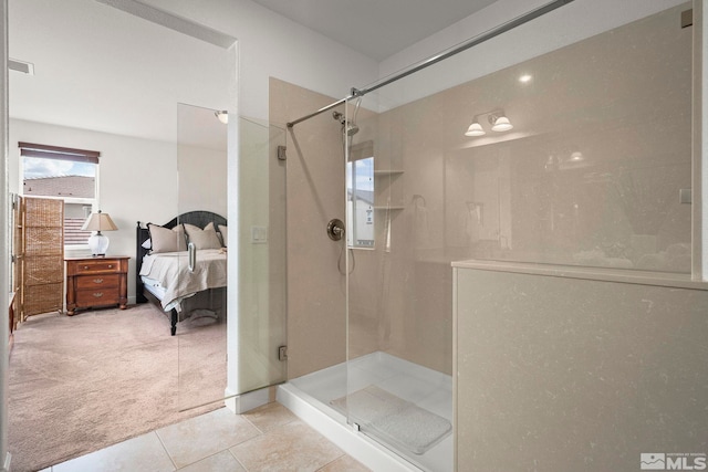 ensuite bathroom featuring a shower stall, visible vents, tile patterned flooring, and ensuite bathroom