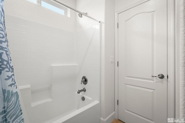 full bathroom with shower / bath combo with shower curtain