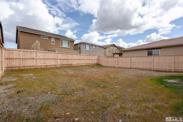 view of yard with fence