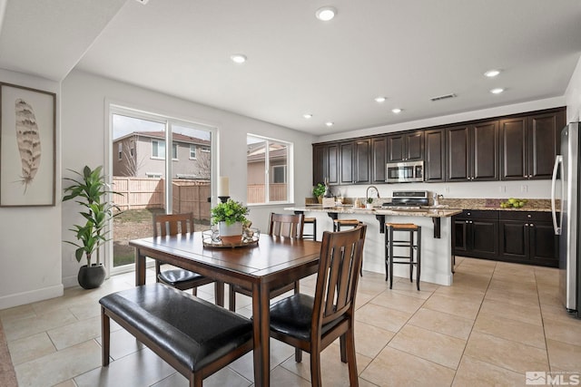 dining room with visible vents, baseboards, light tile patterned flooring, and recessed lighting
