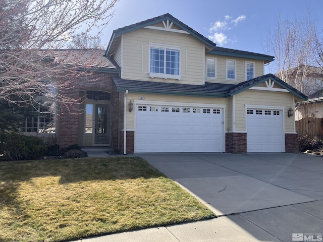 view of front of home featuring driveway, brick siding, a front lawn, and an attached garage
