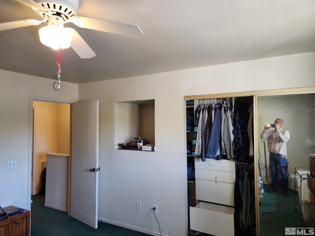 carpeted bedroom featuring a closet and a ceiling fan