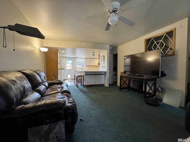 living room with carpet floors and a ceiling fan