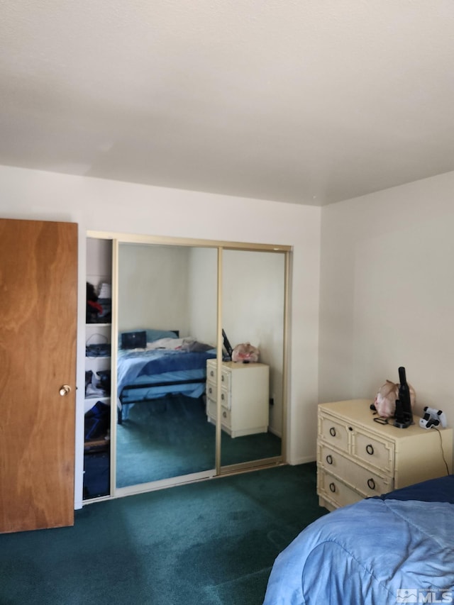 carpeted bedroom with a closet