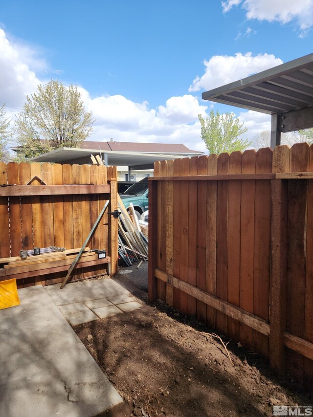 view of patio / terrace with a gate and fence