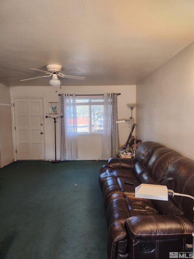 living room featuring ceiling fan and carpet flooring