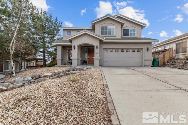 traditional-style home with fence, stucco siding, driveway, a porch, and a garage