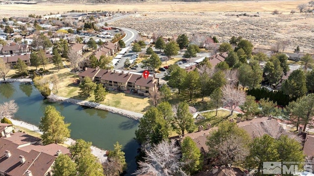 aerial view with a water view and a residential view