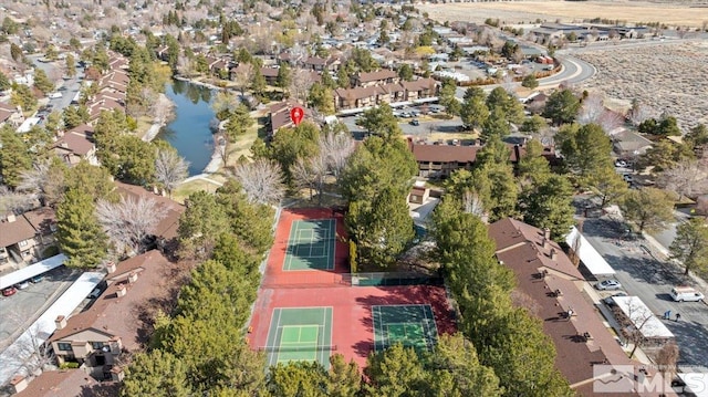 birds eye view of property featuring a residential view and a water view