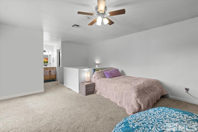 bedroom featuring visible vents, baseboards, and light carpet