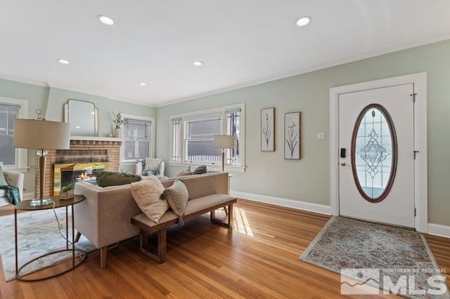 interior space with wood finished floors, baseboards, and recessed lighting