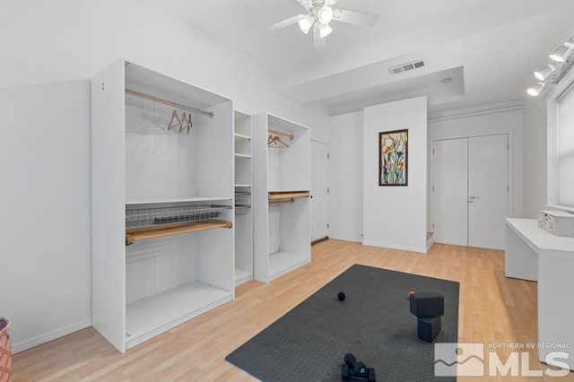 interior space with visible vents, ceiling fan, and light wood-type flooring