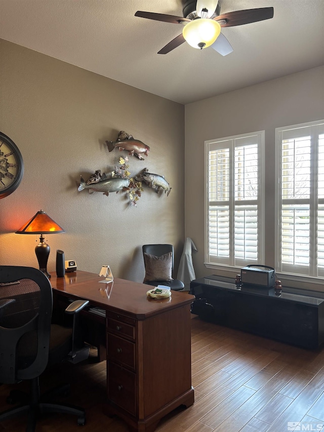 home office with wood finished floors and ceiling fan