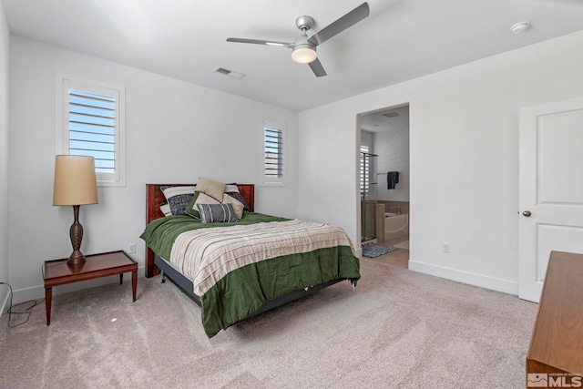 bedroom with visible vents, baseboards, a ceiling fan, carpet, and connected bathroom