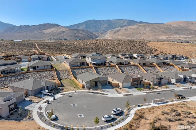 drone / aerial view featuring a mountain view and a residential view