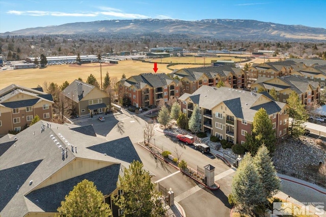 drone / aerial view with a mountain view and a residential view