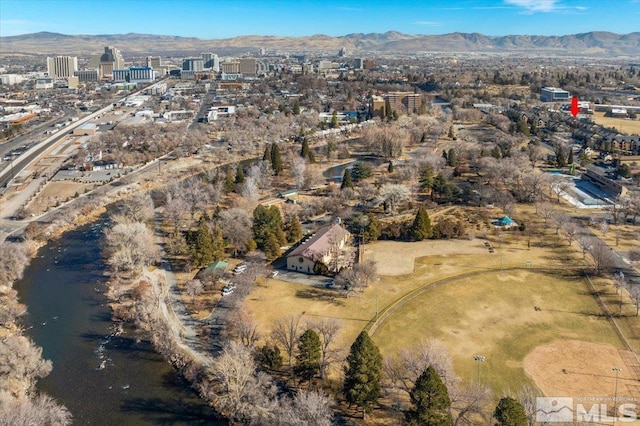 drone / aerial view featuring a view of city and a mountain view