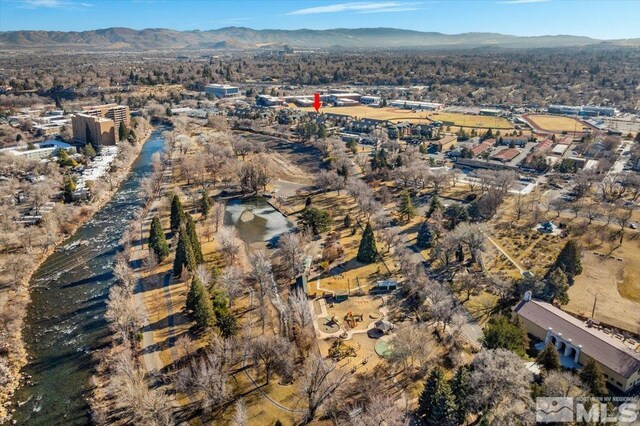birds eye view of property featuring a mountain view