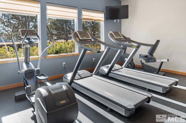 exercise room with baseboards