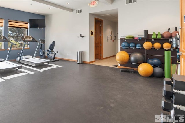 exercise room featuring visible vents and baseboards