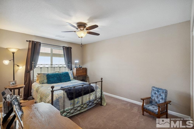 bedroom featuring visible vents, baseboards, carpet flooring, and ceiling fan