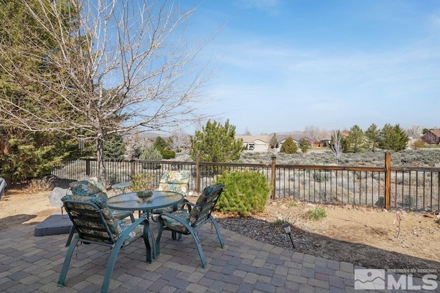 view of patio featuring outdoor dining space and a fenced backyard