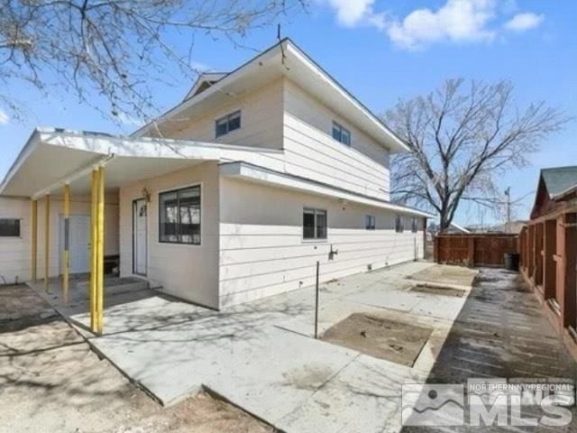 back of house featuring a patio and fence private yard