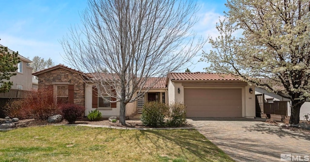 view of front of house with stone siding, a garage, a tile roof, stucco siding, and driveway