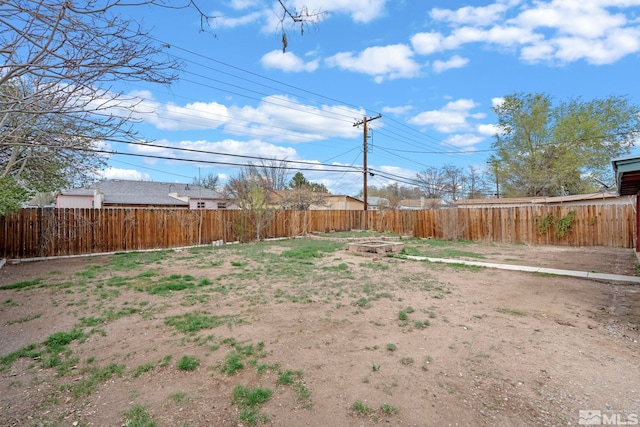 view of yard with a fenced backyard