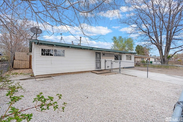 ranch-style house with fence and a gate