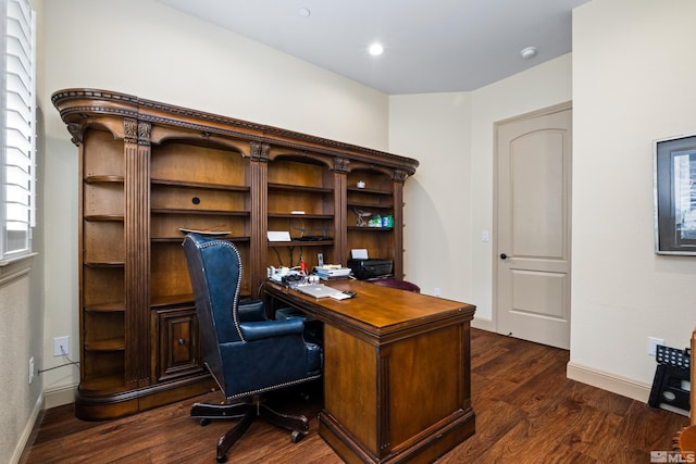 office area with dark wood-type flooring, baseboards, and plenty of natural light