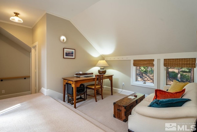 carpeted home office with crown molding, baseboards, and lofted ceiling