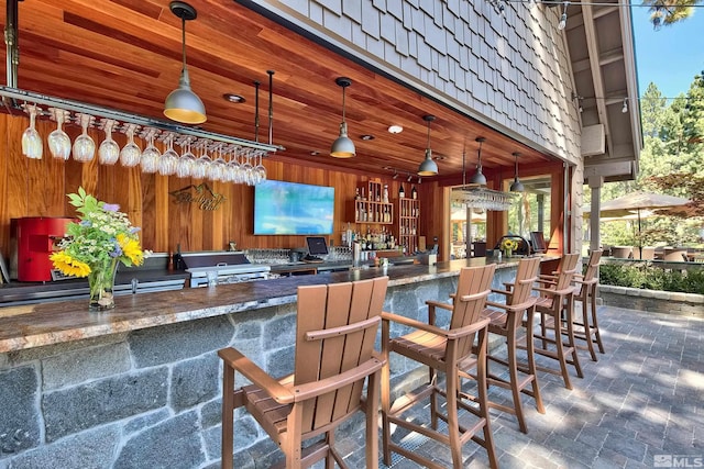 bar with wooden walls and a community bar