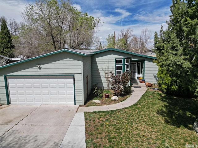 ranch-style house featuring an attached garage, driveway, and a front lawn