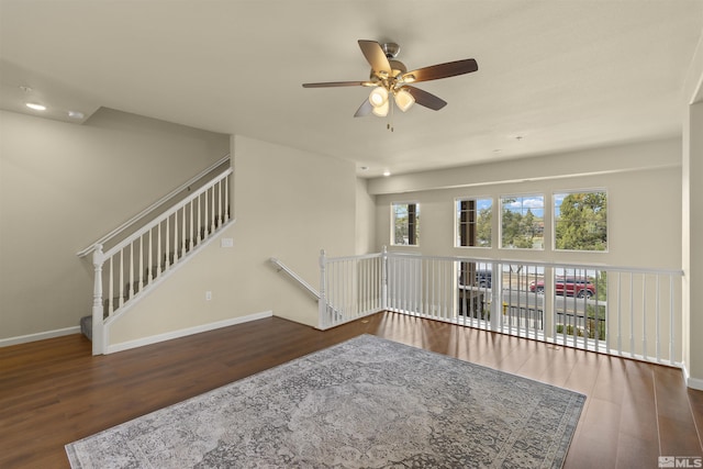 empty room with ceiling fan, recessed lighting, wood finished floors, and baseboards