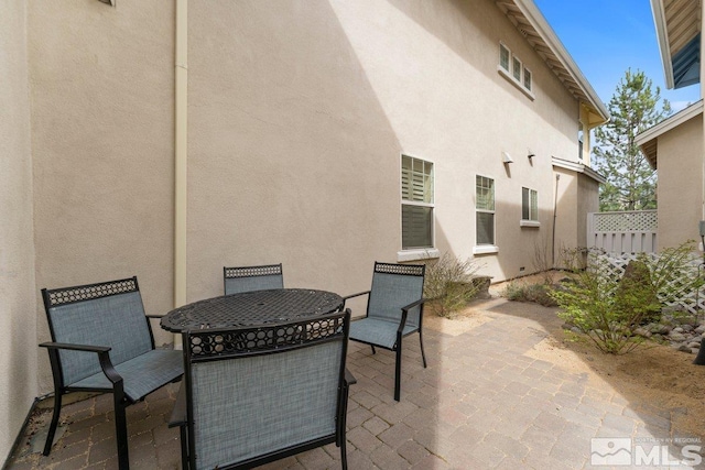 view of patio / terrace with outdoor dining space and fence