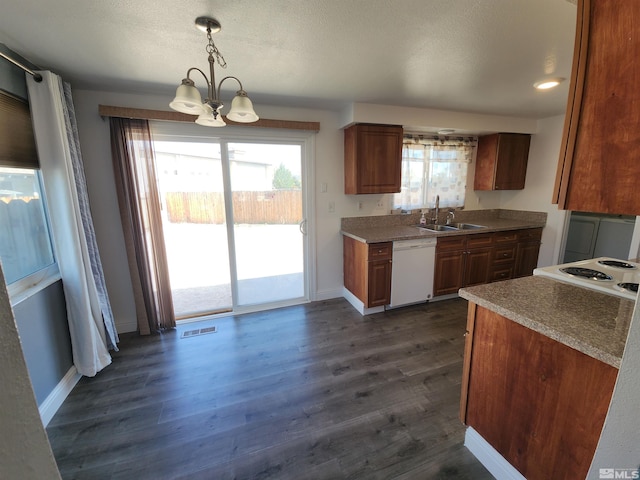 kitchen featuring an inviting chandelier, a sink, white appliances, and dark wood-style flooring