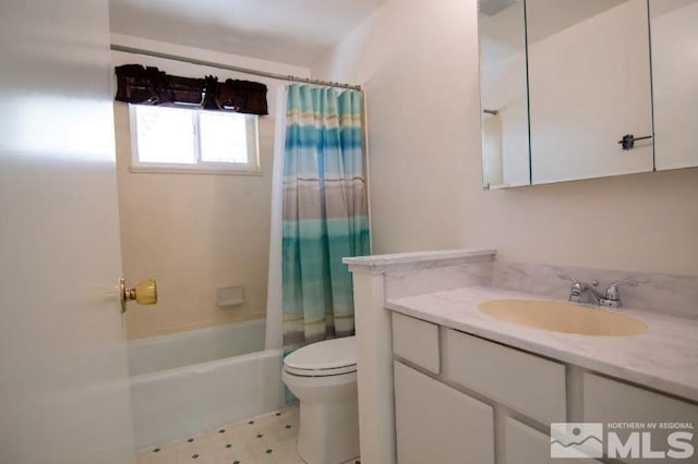 bathroom featuring toilet, vanity, and shower / bath combo with shower curtain